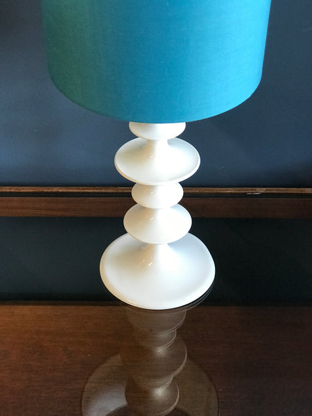 White hooped metal table lamp with blue shade