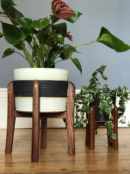 Curved mid-century plant pot stands