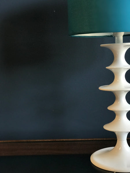 White hooped metal table lamp with blue shade