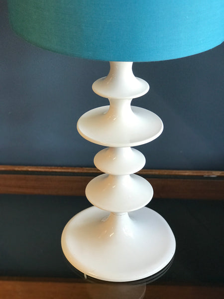 White hooped metal table lamp with blue shade