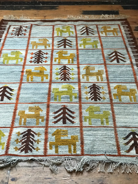 Lovely large vintage wool rug with images of horses and trees