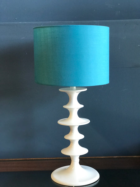 White hooped metal table lamp with blue shade