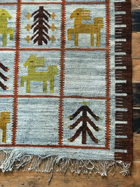 Lovely large vintage wool rug with images of horses and trees