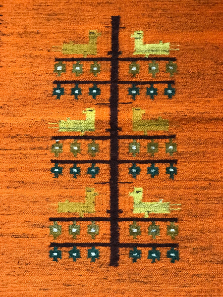 Orange wool rug with white fringe